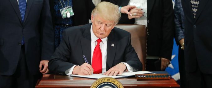 President Donald Trump signs an executive order temporarily banning citizens of Iran, Iraq, Libya, Syria, Sudan, Yemen, and Somalia from entering the United States.